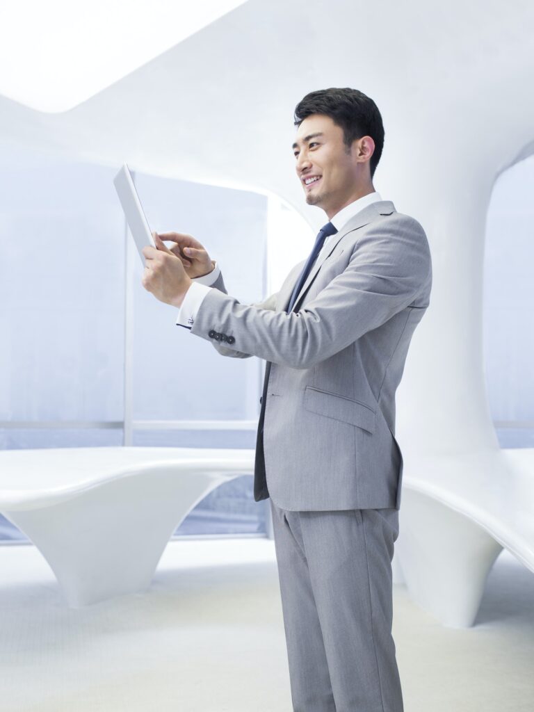 Businessman using digital tablet in office